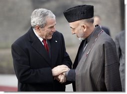 President George W. Bush bids farewell to President Hamid Karzai of Afghanistan as he prepares to depart the presidential palace Monday, Dec. 15, 2008, in Kabul.  White House photo by Eric Draper