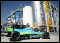 President George W. Bush is joined by officials from Novozymes North America, Inc. Wednesday, Feb. 22, 2007, as he is shown a race car that is fueled by ethanol, during his tour of the Novozymes, a biotechnology facility in Franklinton, N.C. White House photo by Paul Morse