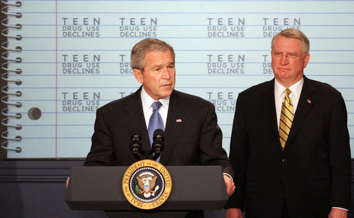 President George W. Bush delivers a statement Dec. 11, 2007, on Monitoring the Future Study on Teen Drug Use as John Walters, Director of the Office of National Drug Control Policy, listens on. White House photo by Chris Greenberg