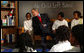 President George W. Bush talks to fourth-graders during a visit January 5, 2004, to the Pierre Laclede Elementary School in St. Louis. White House photo by Tina Hager
