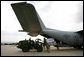 A U.S. Army crew offloads USAID humanitarian supplies from a C-130 aircraft Thursday, Sept. 4, 2008 during a visit by Vice President Dick Cheney to a U.S. relief operation center at Tbilisi International Airport, Georgia. Through U.S. relief efforts, Georgians affected by the recent Russian aggression are receiving cots, blankets, food rations and hygiene packs. White House photo by David Bohrer