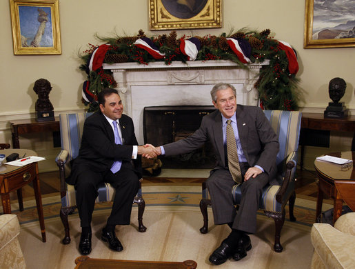 President George W. Bush and President Antonio Saca of El Salvador shake hands as they meet Tuesday, Dec. 16, 2008, in the Oval Office of the White House. White House photo by Eric Draper