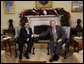 President George W. Bush and President Antonio Saca of El Salvador shake hands as they meet Tuesday, Dec. 16, 2008, in the Oval Office of the White House.  White House photo by Eric Draper