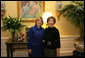 Mrs. Laura Bush poses Tuesday, Dec. 16, 2008, with Mrs. Ana Ligia Mixco Sol de Saca, wife of El Salvador's President Elias Antonio Saca, after Mrs. Saca's arrival in the Residence of the White House for a coffee. White House photo by Shealah Craighead