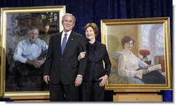President George W. Bush and Mrs. Laura Bush stand in front of their portraits Friday, Dec. 19, 2008, after the unveiling at the Smithsonian's National Portrait Gallery in Washington, D.C. The portrait of Mrs. Bush was done by Aleksander Sasha Titovets; the Presidential portrait was done by Robert Anderson.  White House photo by Eric Draper