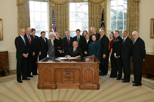 President George W. Bush signs H.R. 7311, the William Wilberforce Trafficking Victims Protection Reauthorization Act, Tuesday, Dec. 23, 2008, in the Oval Office of the White House. Named for English abolitionist William Wilberforce, who led the Parliamentary movement against the British slave trade in the early 19th century, this bill authorizes appropriations for fiscal years 2008 through 2011 for the Trafficking Victims Protection Act of 2000, enhancing measures to combat trafficking in persons. White House photo by Joyce N. Boghosian