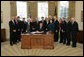 President George W. Bush signs H.R. 7311, the William Wilberforce Trafficking Victims Protection Reauthorization Act, Tuesday, Dec. 23, 2008, in the Oval Office of the White House. Named for English abolitionist William Wilberforce, who led the Parliamentary movement against the British slave trade in the early 19th century, this bill authorizes appropriations for fiscal years 2008 through 2011 for the Trafficking Victims Protection Act of 2000, enhancing measures to combat trafficking in persons.  White House photo by Joyce N. Boghosian