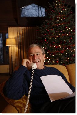 President George W. Bush makes Christmas Eve telephone calls to members of the Armed Forces, Wednesday, Dec. 24, 2008, from Camp David. White House photo by Eric Draper
