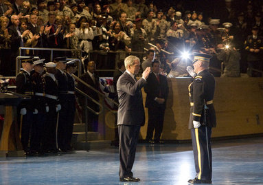 President George W. Bush salutes Col. Joseph Buche, Commander of Troops at Ft. Myer, Va., after reviewing the troops Tuesday, Jan. 6, 2009, during a military appreciation in the President's honor as Commander-in-Chief. White House photo by Joyce N. Boghosian