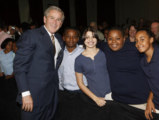 President George W. Bush poses with a group of students Thursday, Jan. 8, 2009, following his address at the General Philip Kearny School in Philadelphia, where President Bush spoke about the success of the No Child Left Behind Act and urged Congress to strenghten and reauthorize the legislation. White House photo by Chris Greenberg