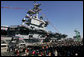 Guests and U.S. Navy personnel crowd the dock at the commissioning ceremony of the USS George H.W. Bush (CVN 77) aircraft carrier Saturday, Jan 10, 2009 in Norfolk, Va., named in honor of former President George H.W. Bush. White House photo by Joyce N. Boghosian