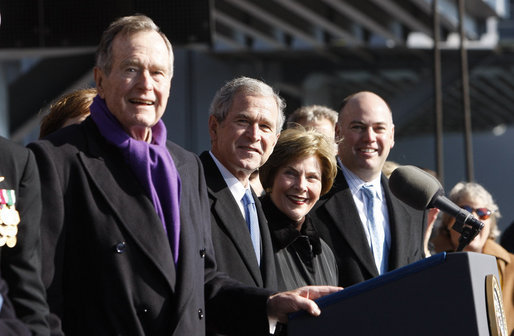 President George W. Bush stands with his father, former President George H. W. Bush and Mrs. Laura Bush during the commissioning ceremony of the USS George H. W. Bush (CVN 77) aircraft carrier Saturday, Jan 10, 2009 in Norfolk, Va. White House photo by Eric Draper
