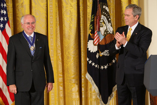 President George W. Bush applauds former Prime Minister John Howard after presenting the Australian leader with the 2009 Presidential Medal of Freedom during ceremonies Tuesday, Jan.13, 2009, in the East Room of the White House. White House photo by Chris Greenberg