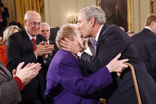 President George W. Bush kisses Arlene Howard on the forehead following his farewell address to the nation Thursday evening, Jan. 15, 2009 in the East Room of the White House. The President met Ms. Howard shortly after Sept. 11, 2001, where she gave him her son's police badge after he perished in the terrorists attacks on the World Trade Center. President Bush still carries the badge with him today as a reminder of all that was lost. White House photo by Eric Draper