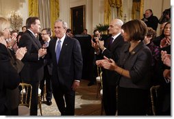 President George W. Bush grasps hands with Former Homeland Security Advisor, Tom Ridge, as he receives applause following his address to the nation Thursday evening, Jan. 15, 2009, from the East Room of the White House. White House photo by Eric Draper