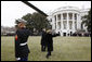 President George W. Bush and Mrs. Laura Bush wave to an awaiting crowd Sunday, Jan. 18, 2009 on the South Lawn of the White House, upon their return from Camp David aboard Marine One. White House photo by Chris Greenberg