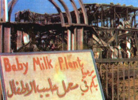 Photo of a hand-lettered sign that says "Baby Milk Factory" in both English and Arabic