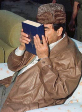 Photo of Saddam Hussein in act of Muslim piety.