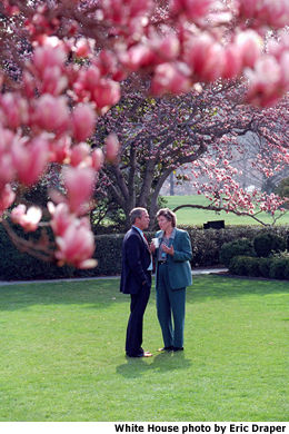 President Bush talks alone with Karen Hughes, Counselor to the President, in the Rose Garden. White House photo by Eric Draper