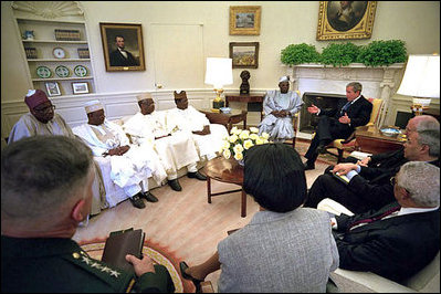 President George W. Bush meets with President Olusegun Obasanjo of Nigeria in the Oval Office May 11, 2001. President Bush and President Obasanjo discussed the need for peacekeeping training of African troops.
