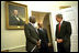  President George W. Bush welcomes President Daniel arap Moi of Kenya and Prime Minister Meles Zenawi of Ethiopia to the Oval Office Dec. 5, 2002. These leaders, who are friends and allies of America, have joined in global war on terror. President Bush stressed the global reach of the war and noted that if the terrorists could strike in Kenya, they could strike in Ethiopia or anywhere.