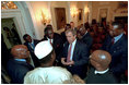 President George W. Bush meets with President John Kufuor of Ghana, left, President Abdoulaye Wade of Senegal, far left, and President Oumar Konare of Mali, center, in the Cabinet Room June 28, 2001. President Bush's pledge of assistance and quick response helped Ghana recover from a flood emergency at that time.