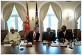 President George W. Bush talks with President Abdoulaye Wade of Senegal, center, as President Oumar Konare of Mali, left, and President John Kufuor of Ghana, right, listen during a meeting in the Cabinet Room June 28, 2001. President Bush met with these heads of state of Africa's promising democracies to affirm their shared opposition to governments that come to power by unconstitutional means. President Bush expressed appreciation for the participation of Ghana, Senegal and Mali in U.S. initiatives, such as the African Crisis Response Initiatives and Operation Focus Relief.