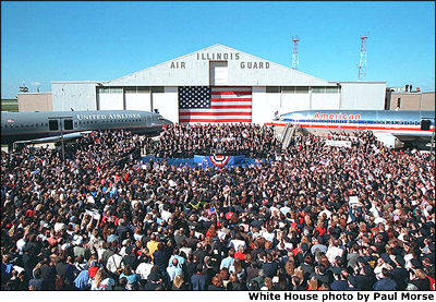 More than 6,000 airline employees crowd together on the tarmac at Chicago's O'Hare International Airport to meet President Bush and honor their industry colleagues Sept. 27. "I think it's interesting that on one side, we see American; on the other side, it says United," said the President in his remarks. "Because that's what we are -- America is united.". White House photo by Paul Morse. 