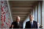 President George W. Bush and Prime Minister John Howard of Australia look over the World War II Roll of Honor at the Australian War Memorial in Canberra, Australia, Thursday, Oct. 23, 2003.