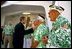 President George W. Bush greets veterans at the USS Arizona Memorial in Honolulu, Hawaii, Thursday, Oct. 23, 2003. The memorial honors those who served during the attack on Pearl Harbor Dec. 7, 1941. 