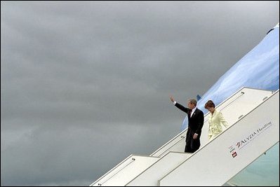President George W. Bush waves as he and Laura Bush depart Air Force One upon arrival in Paris May 26, 2001. During his trip to Europe the President traveled to Germany, France, Russia, and Italy, including the cities of Normandy, Berlin, Moscow, St. Petersburg and Rome.