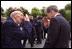 President Bush salutes a veteran during a Memorial Day service at the Saint Marie Eglise Church in Saint Marie Eglise, near Normandy, France, May 27.