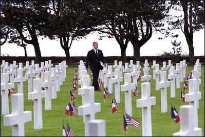 President Bush visits the American cemetery near Omaha Beach at Normandy, France, May 27. "All who come to a place like this feel the enormity of the loss. Yet, for so many, there is a marker that seems to sit alone -- they come looking for that one cross, that one Star of David, that one name," said the President in his remarks. "Behind every grave of a fallen soldier is a story of the grief that came to a wife, a mother, a child, a family, or a town."