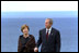 President Bush and Mrs. Bush take a walking tour of Omaha Beach at Normandy, France, May 27.