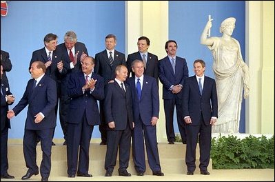 President Bush and President Putin talk during a group photo session of European leaders in Rome May 28.