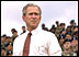 President George W. Bush addresses troops and families of the 10th Mountain Division at Fort Drum, N.Y., July 19, 2002. .This great base, the 10th Mountain Division, has a special place in American military history,. said the President. .Fort Drum has given continuous service to the defense of our country since the beginning of the last century. This unit has produced some of the finest soldiers ever to wear the uniform."
