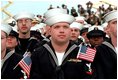 Sailors listen to President George W. Bush aboard the USS Enterprise in Norfolk, Va., on the 60th anniversary of the Pearl Harbor attack Dec. 7, 2001. "Today is an anniversary of a tragedy for the United States Navy," said the President. "Yet, out of that tragedy, America built the strongest Navy in the world. And there is no better symbol of that strength than the USS Enterprise."