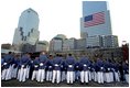 Cadets pay their respects to the victims of the World Trade Center disaster at Ground Zero in New York, Sept. 11, 2002. "For members of our military, it's been a year of sacrifice and service far from home," said the President. "For all Americans, it has been a year of adjustment, of coming to terms with the difficult knowledge that our nation has determined enemies, and that we are not invulnerable to their attacks."