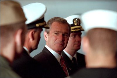 President George W. Bush meets with military personnel aboard the USS Enterprise in Norfolk, Va., Dec. 7, 2001. "When America looks at you, the young men and women who defend us today, we are grateful," said the President. "On behalf of the people of the United States, I thank you for your commitment, your dedication and your courage."