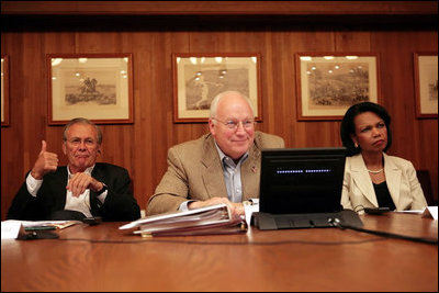 Vice President Dick Cheney is seated with Secretary of State Condoleezza Rice and Secretary of Defense Donald Rumsfeld as they participate in a video teleconference from Camp David, Md., Tuesday, June 13, 2006 with President Bush and Iraqi Prime Minister Nouri al-Maliki in Baghdad. White House photo by David Bohrer 