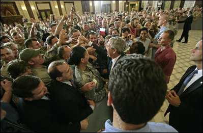 President greets U.S. troops and U.S. embassy personnel during his trip to Baghdad, Iraq, Tuesday, June 13, 2006. "This is a moment -- this is a time where the world can turn one way or the other, where the world can be a better place or a more dangerous place," said the President. "And the United States of America and citizens such as yourself are dedicated to making sure that the world we leave behind is a better place for all." White House photo by Eric Draper