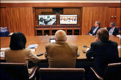 Vice President Dick Cheney, Secretary of Defense Donald Rumsfeld, right, and Secretary of State Condoleezza Rice, left, participate in a video teleconference from Camp David, Md., Tuesday, June 13, 2006 as President Bush meets Iraqi Prime Minister Nouri al-Maliki in Baghdad. The President expressed praise for Prime Minister Maliki's efforts in assembling a strong and diverse unity government in Iraq and said, "I want to thank you for giving me and my cabinet a chance to hear from you personally and a chance to meet the members of this team you've assembled. It's an impressive group of men and women, and if given the right help, I'm convinced you will succeed, and so will the world." White House photo by David Bohrer 