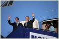 President George W. Bush and Prime Minister Anders Fogh Rasmussen wave from Air Force One upon the President's arrival to Kastrup, Denmark, Tuesday, July 5, 2005.