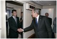President George W. Bush welcomes Prime Minister Anders Fogh Rasmussen aboard Air Force One after arriving in Kastrup, Denmark, Tuesday, July 5, 2005.
