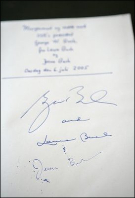 The signatures of President Bush and Laura Bush are written in the guest book at Prime Minister Anders Fogh Rasmussen's summer residence in Marienborg in Kongens Lyngby, Denmark, Wednesday, July 6, 2005.