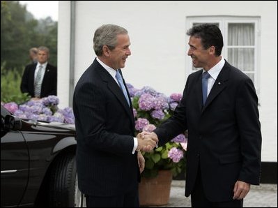 President George W. Bush is greeted by Danish Prime Minister Anders Fogh Rasmussen at his summer residence in Marienborg in Kongens Lyngby, Denmark, Wednesday, July 6, 2005.