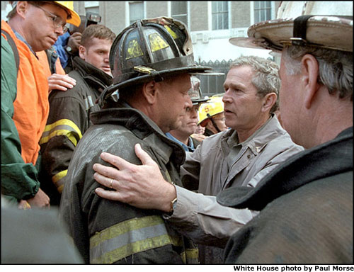 President Bush comforts a firefighter in New York, Sept. 14