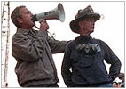 Photo of President Bush holding a bullhorn in New York
