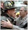 Photo of President Bush hugging a firefighter.