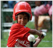 Photo of a tee-ball player on the South Lawn.